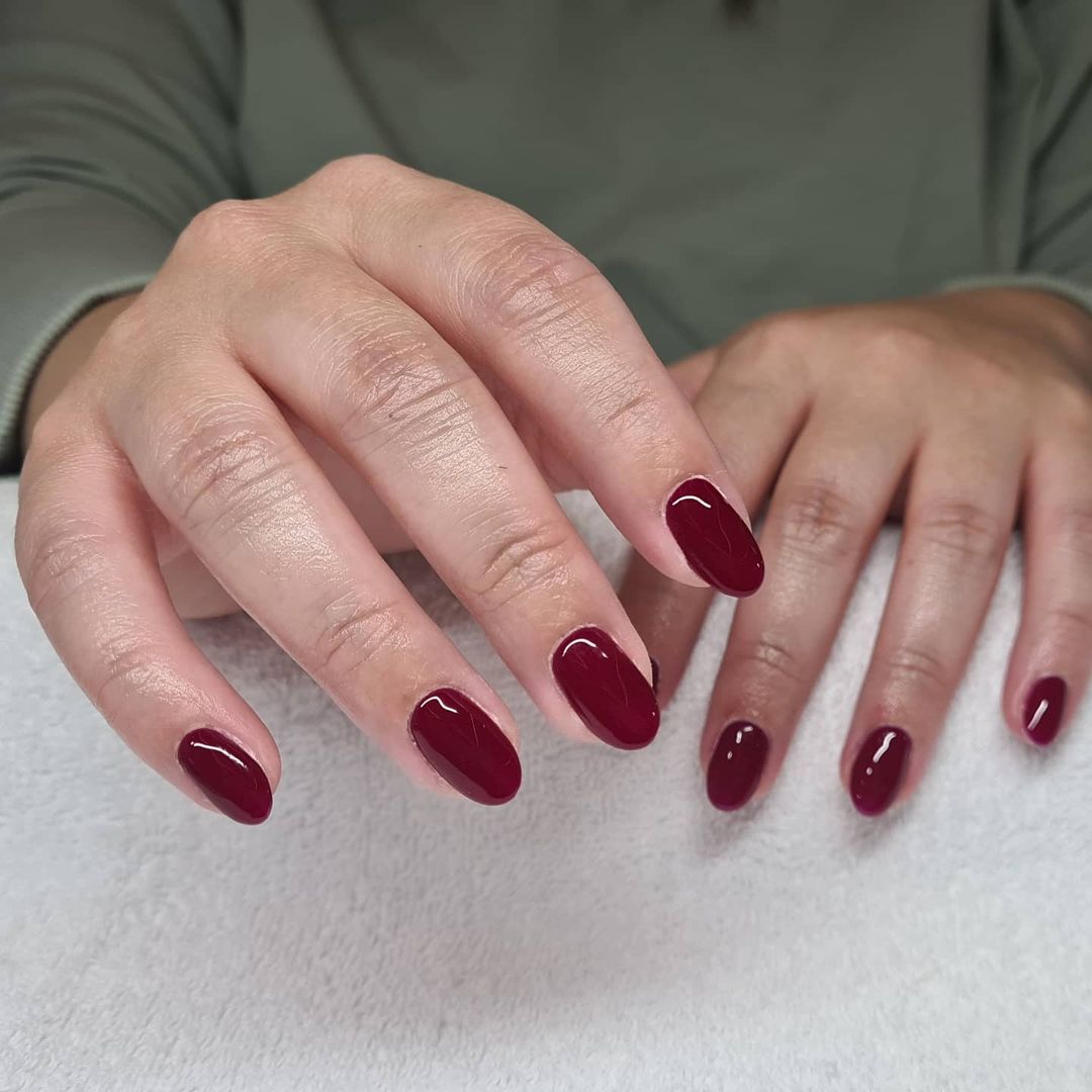 Deep burgundy nail polish