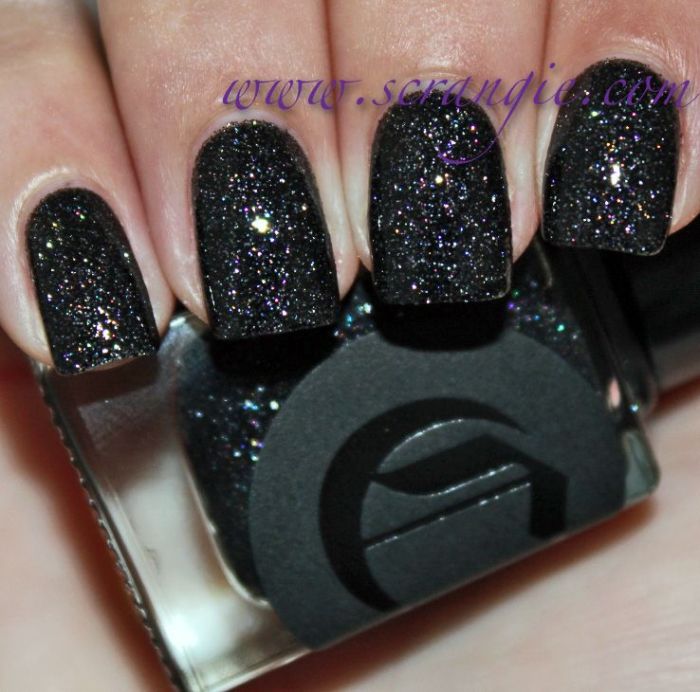 Black nail polish with glitter