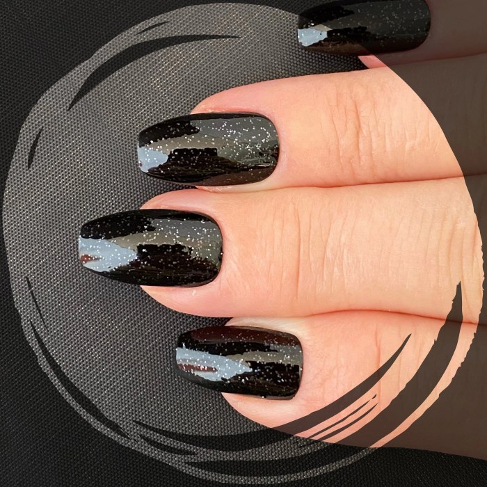 Black nail polish with glitter